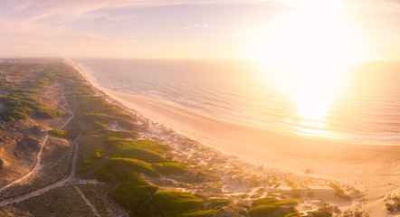 Aerial view of beach at sunset