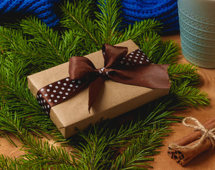 Fototapeta na wymiar Christmas gift or present box wrapped in kraft paper on christmas decoration