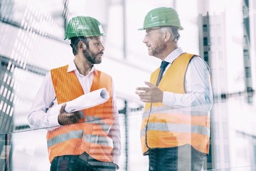 Composite image of men on modern office building