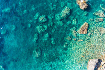 Aerial view of the rocky bottom of the Adriatic Sea covered with turquoise water