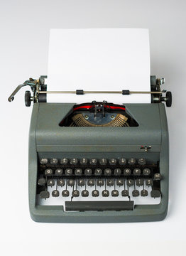 Antique Typewriter on White Background with Paper in Perspective