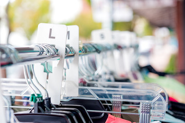 Large size Clothing on wrack outside store