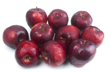 Red apples are delicious on a white background.