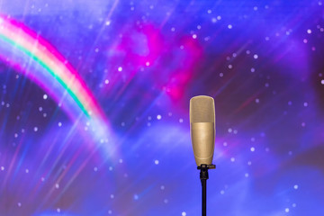 microphone with led ighting background in concert hall.