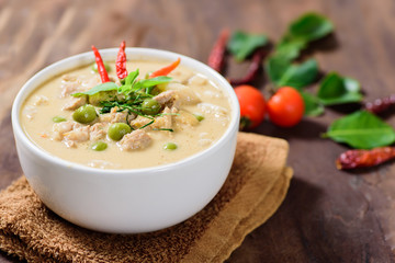 Thai food (Panaeng curry),red curry with pork in a bowl on wooden background