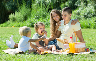 Fototapeta premium Family of four on picnic