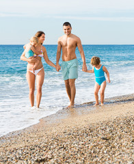 Family of four at the beach