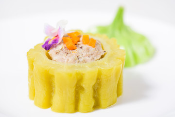 Boiled bitter gourd with pork decorated with carrot and flower,food styling
