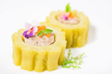 Boiled bitter gourd with pork decorated with carrot and flower,food styling