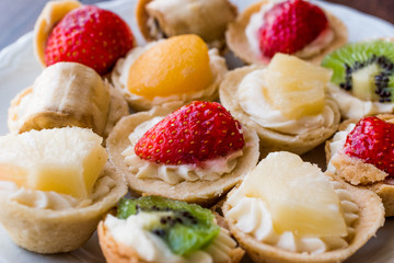 Mini Tarts, Tartolet or Tartlets with cream and fresh fruits