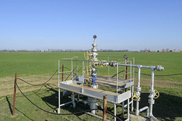 Fototapeta na wymiar The equipment and technologies on oil fields. Oil well