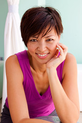 Fototapeta premium Asian woman at the gym exercising.