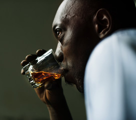 African man getting drunk