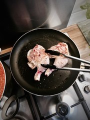 Fresh chicken on the pan