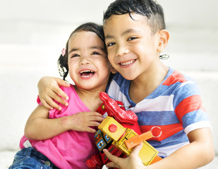 Cute brother and sister playing together
