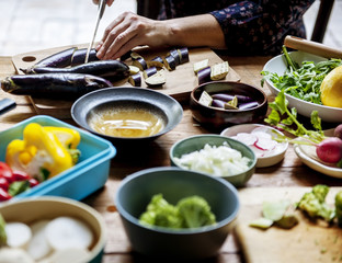 A person slicing vegetable