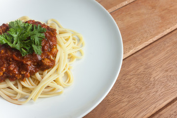 Pasta, macaroni and tomato sauce on a white dish are delicious. Put on a old wooden table.close up