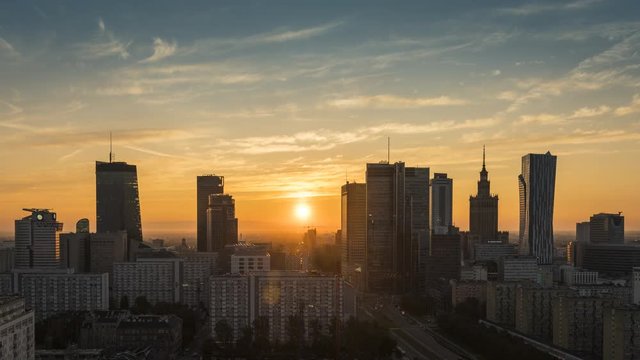 Warsaw downtown skyscrapers at sunrise, Poland. Time lapse at dawn
