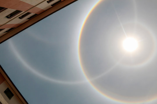 Amazing Sun halo phenomenon over the building in Thailand.