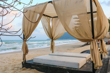 Fototapeta na wymiar Beach bed on the beautiful white sand beach in Thailand.summer holiday concept.