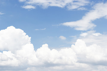 Soft white clouds against blue sky background and empty space for your design, beautiful of nature