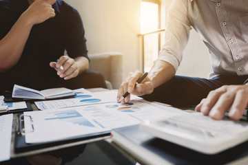 Business executives analyzing on valuation data paper