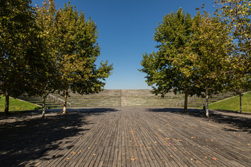 Auditorium with wooden seats in the linear park of the Manzanares in Madrid