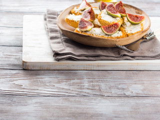 Crostini with cheese and figs. Light sweet and savory snack with wine