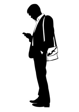 Silhouette of a man in a business suit dialing a number on the phone