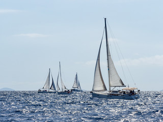 Fototapeta na wymiar Sailing yacht in Croaatia, windy summer on the boat between rocky islands of the Mediterranean sea