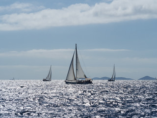 Fototapeta premium Sailing yacht in Croaatia, windy summer on the boat between rocky islands of the Mediterranean sea