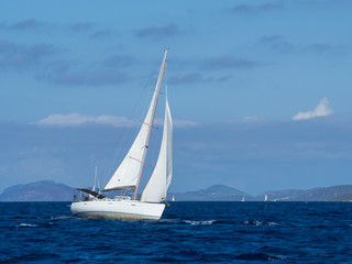 Sailing yacht in Croaatia, windy summer on the boat between rocky islands of the Mediterranean sea