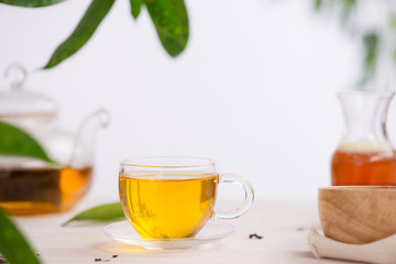 Cups of tea on wooden table background