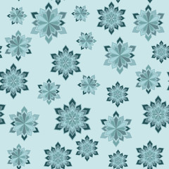 Abstract winter seamless pattern. Snowflakes of different sizes on a light blue background.