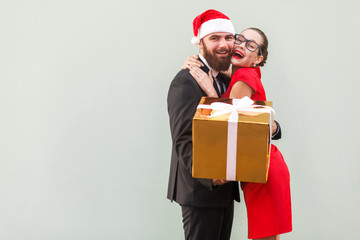 Close up. Love concept. Beautiful girl hugging happy businessman, because he gave a  gifts.