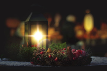 Christmas garland on the table in the light of lamp.