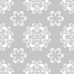 Fototapeta na wymiar Gray and white floral ornament. Seamless pattern for textile and wallpapers