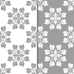 White and gray floral backgrounds. Set of seamless patterns for textile and wallpapers