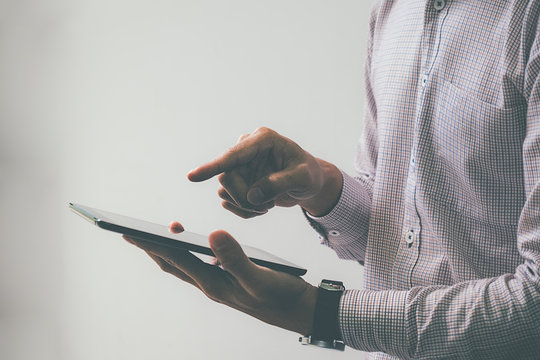 Business process photo. Account manager using mobile phone. Typing contemporary smartphone screen.