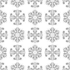 Light gray floral ornament on white background. Seamless pattern for textile and wallpapers