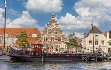 Old ship and historic facade in the center of Leiden