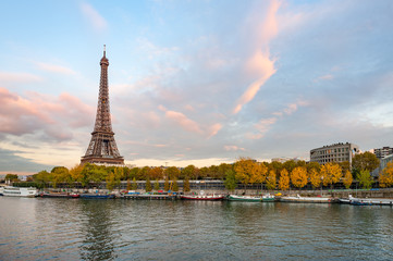 Fototapeta na wymiar Eiffel tower at dusk in paris with river Seine in the foreground, France