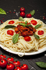 Closeup of delicious spaghetti Bolognaise or Bolognese with savory minced beef and tomato sauce.