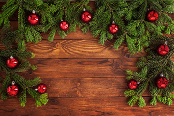 Christmas fir tree with decoration on a wooden board