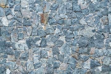 Black, grey and white stone wall background texture