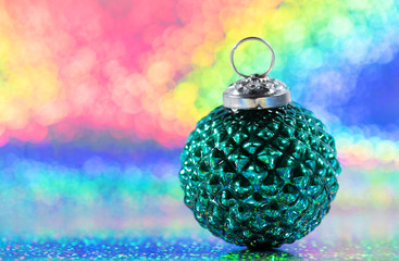 lgbt christmas greeting card concept. xmas tree bauble on rainbow color background with copy space
