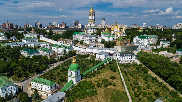 Aerial top view of Kiev Pechersk Lavra churches on hills from above, cityscape of Kyiv city, Ukraine
