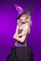 Beautiful woman, blonde in a good witch costume on a purple background. Costume party, young girl....