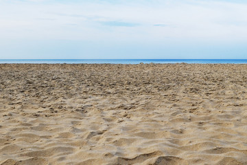 Tattered sandy beach on the Arabian Sea