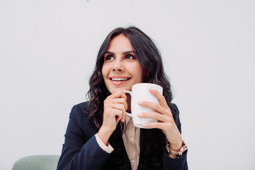 businesswoman with cup of hot drink